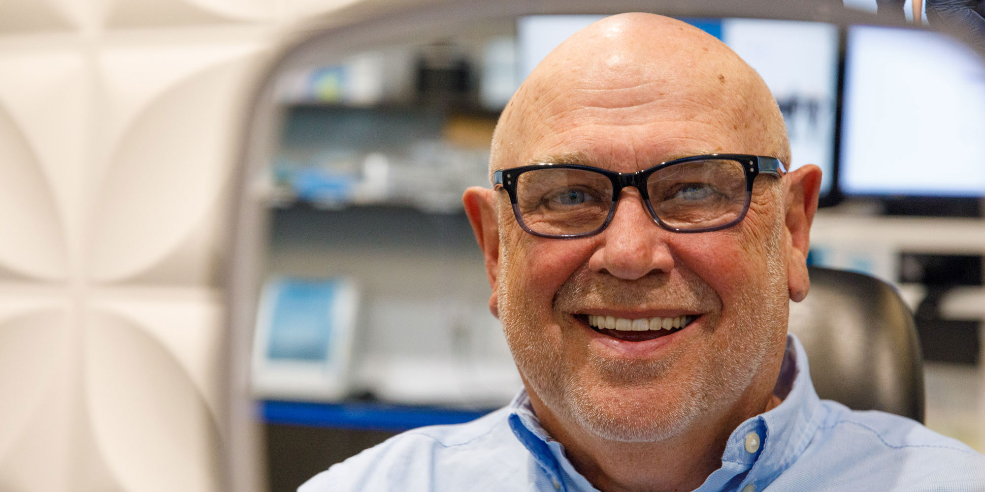 patient smiling brightly after their dental procedure within the dental center