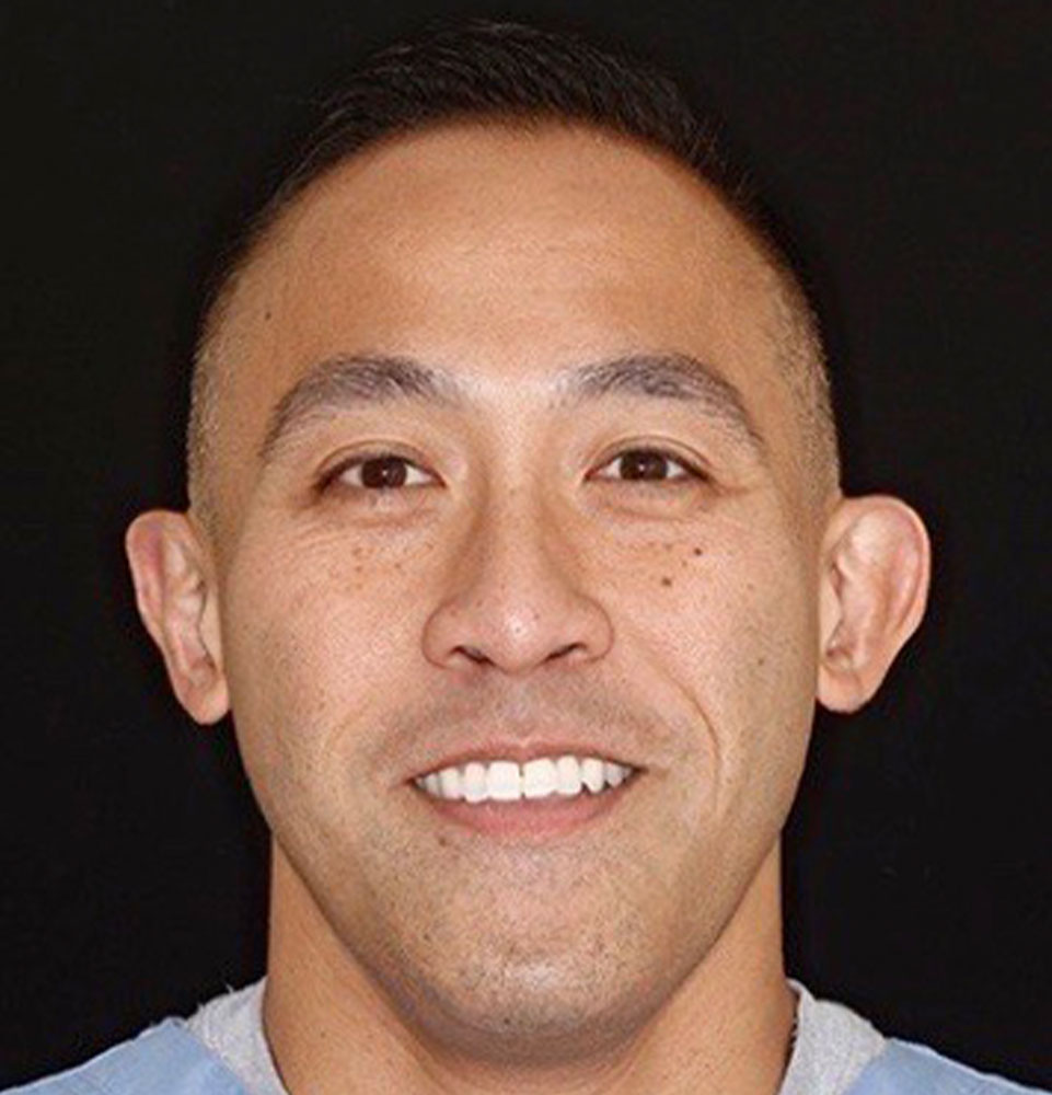 headshot of doctor smiling